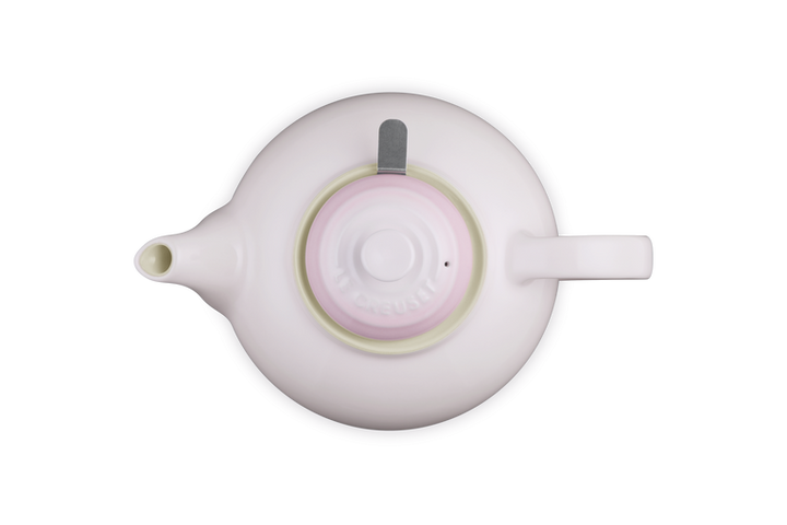 Pink teapot  on a white background