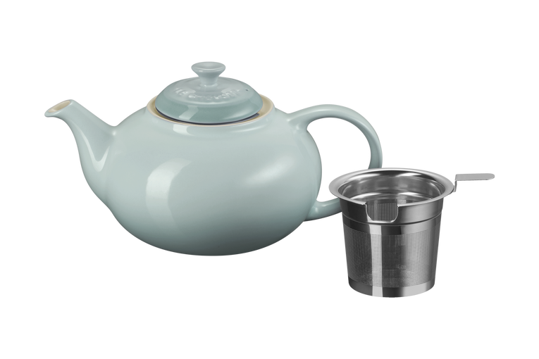 Le Creuset Sea salt teapot with a metal filter on a white background