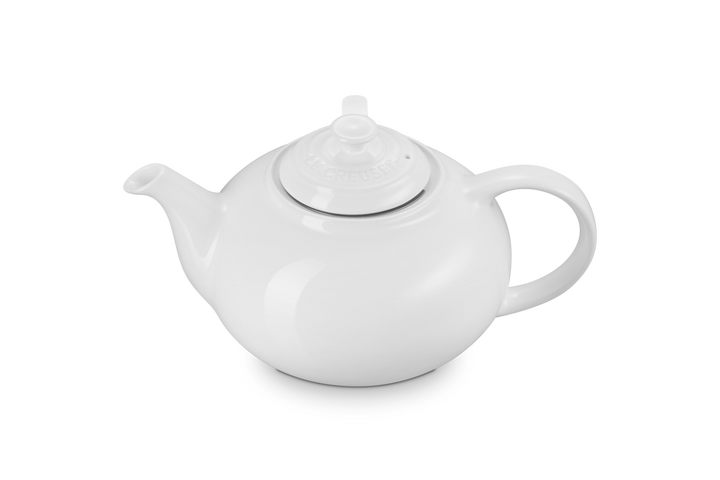 White ceramic teapot on a white background