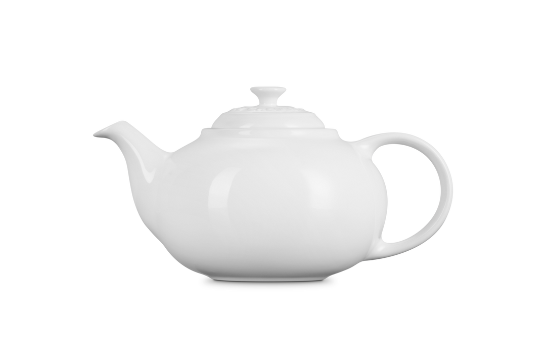 White ceramic teapot on a white background