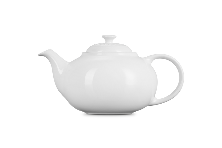 White ceramic teapot on a white background