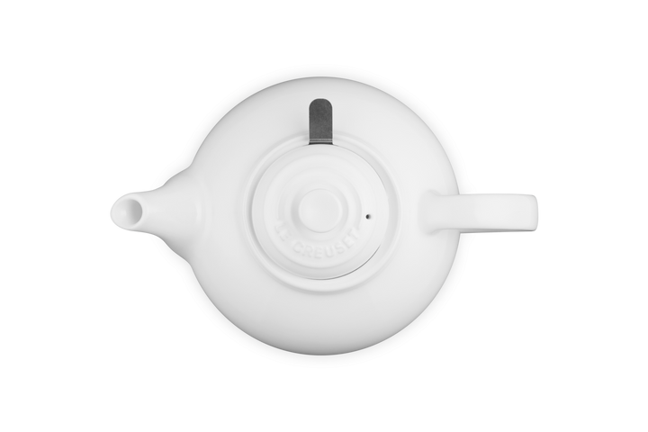 White ceramic teapot on a white background