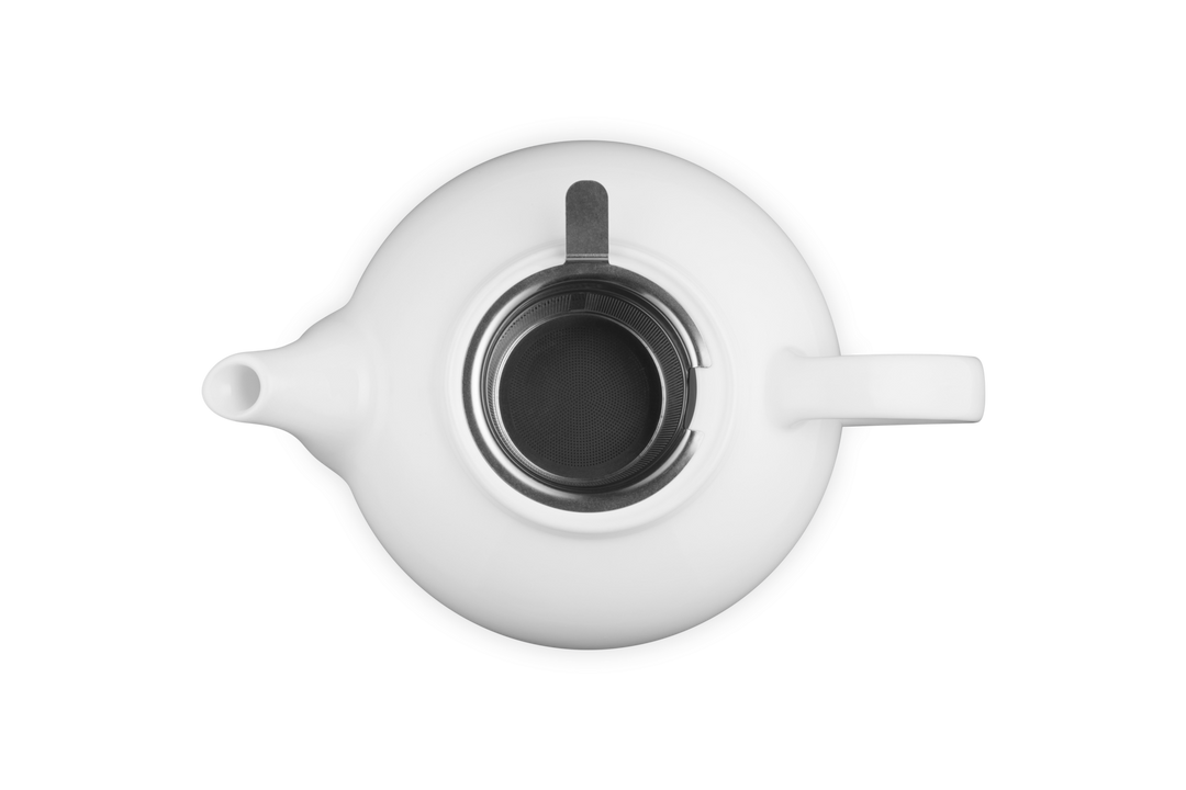 White ceramic teapot on a white background