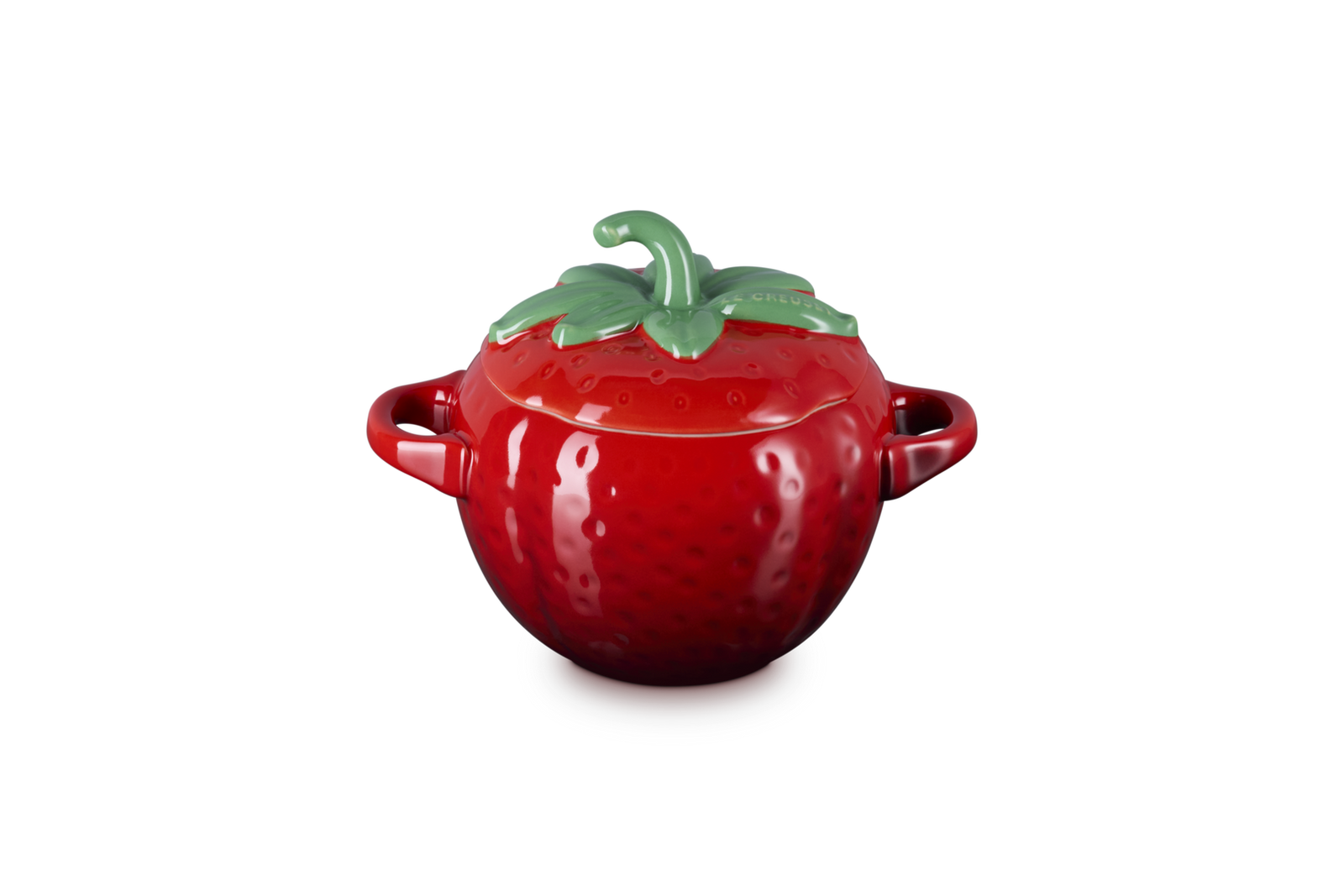 Red ceramic pot shaped like a strawberry with a green lid on a white background