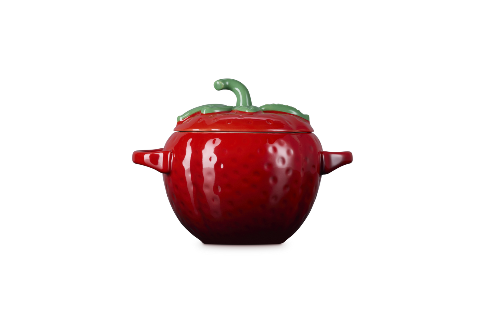 Red ceramic strawberry-shaped container on a white background