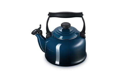 Blue kettle with black handle on a white background