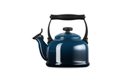 Blue kettle with black handle on a white background