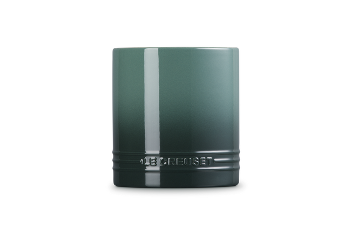 Green utensil jar on a white background