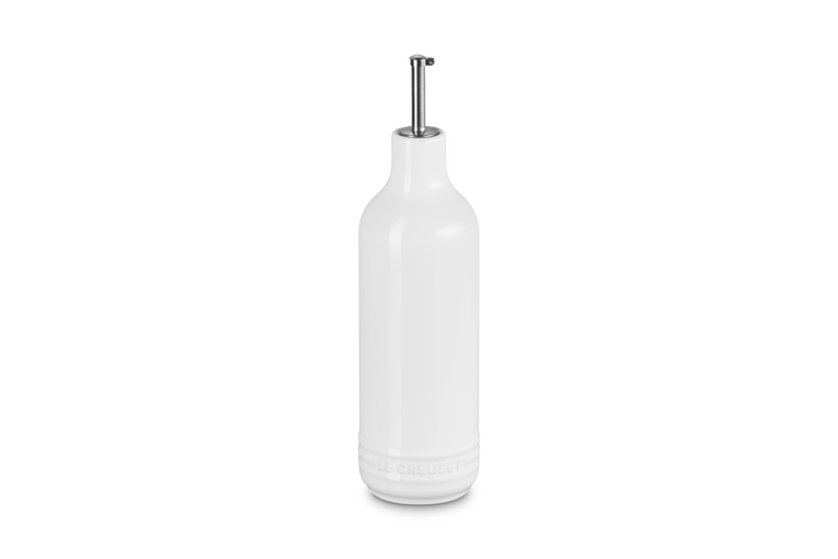 White ceramic oil bottle with a silver cap on a white background