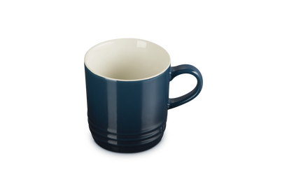 Blue mug with a white interior on a white background