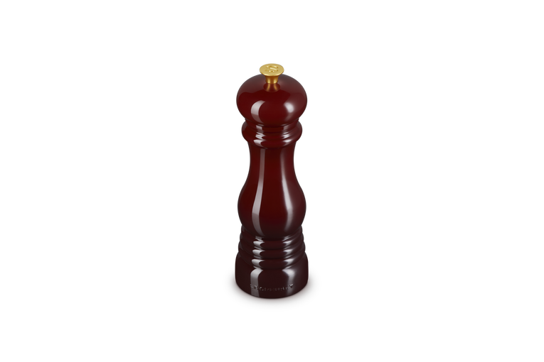 Burgundy salt grinder on a white background