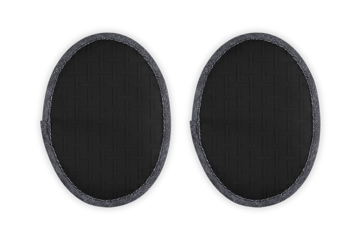 Two black oval-shaped pot holders on a white background