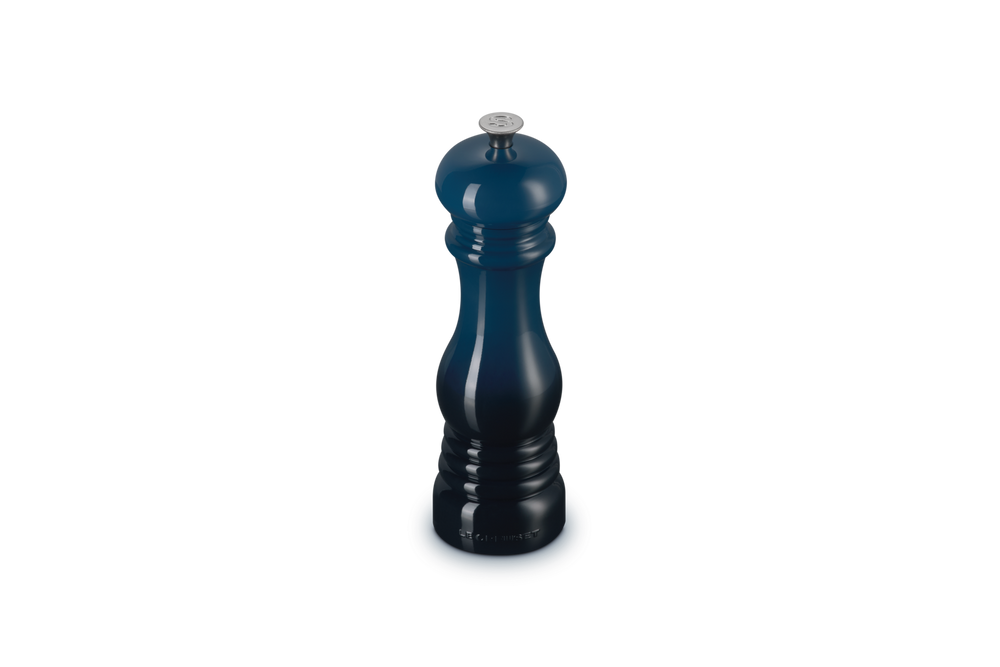 Blue salt grinder on a white background