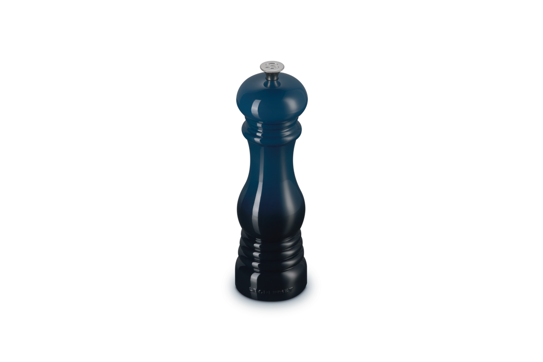 Blue salt grinder on a white background