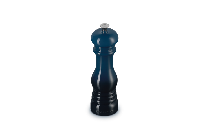 Blue salt grinder on a white background