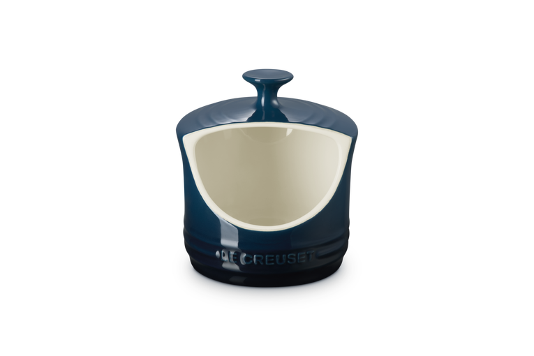 Dark Blue ceramic salt pig with a white interior on a white background