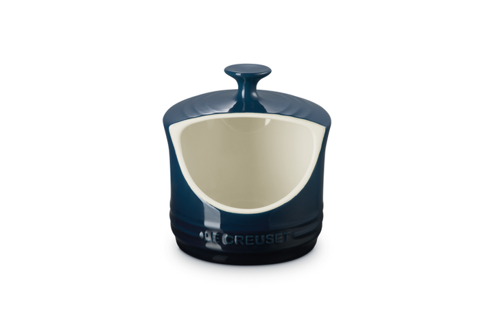 Dark Blue ceramic salt pig with a white interior on a white background
