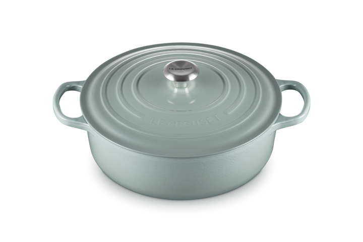 Light blue risotto pot on a white background