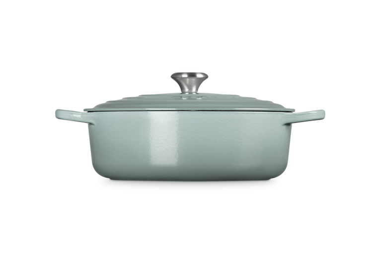 Sea salt cast iron risotto pot with lid on a white background
