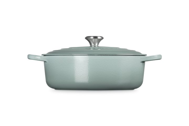 Sea salt cast iron risotto pot with lid on a white background