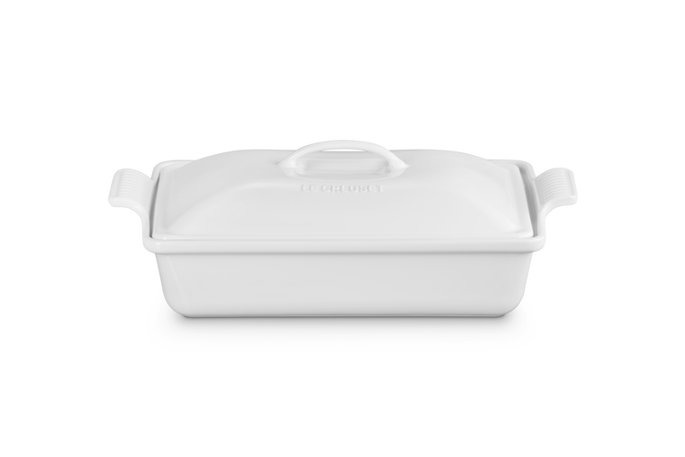 White ceramic baking dish with handles on a white background