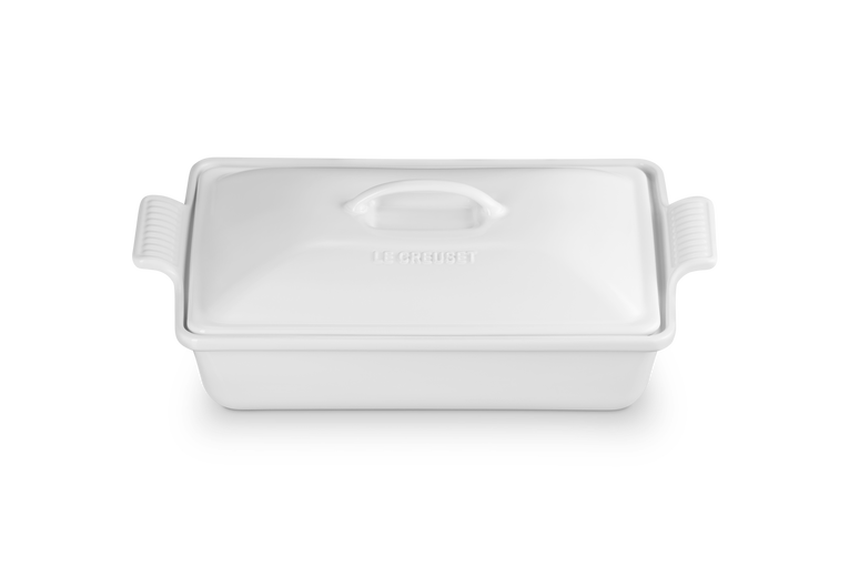 White ceramic baking dish with lid on a white background