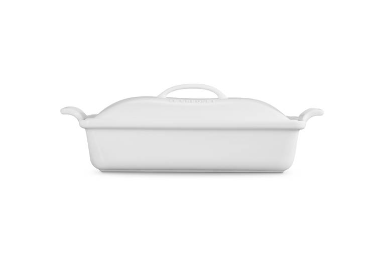 White ceramic baking dish with lid on a white background