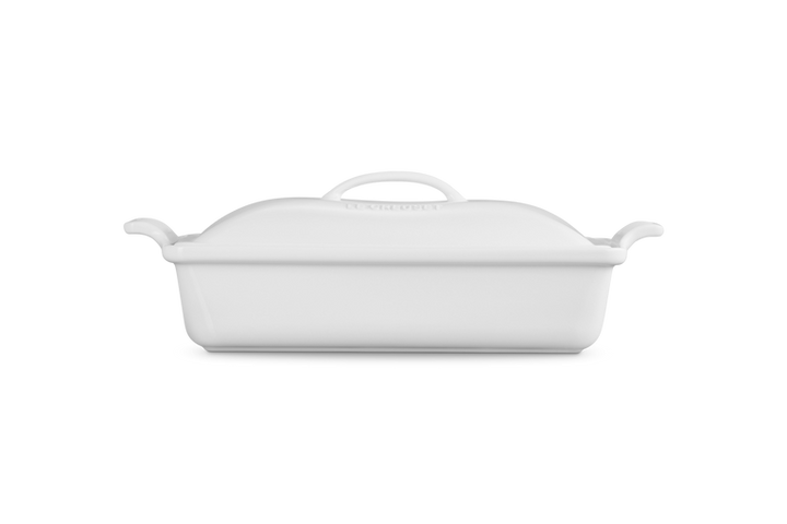 White ceramic baking dish with lid on a white background