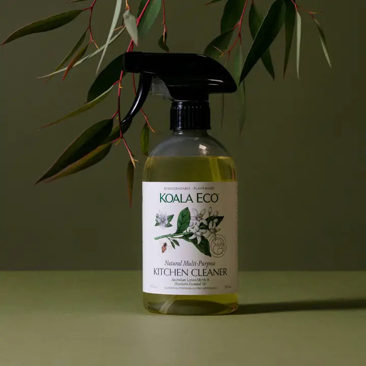 Bottle of Koala Eco kitchen cleaner with a plant in the background