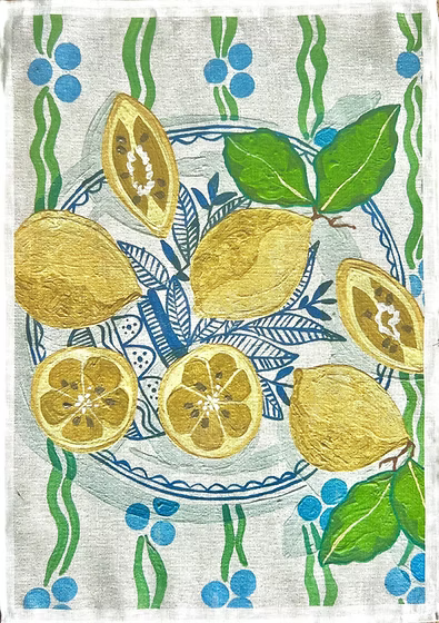 Tea towel with lemon design featuring lemons on a plate, leaves, and berries.