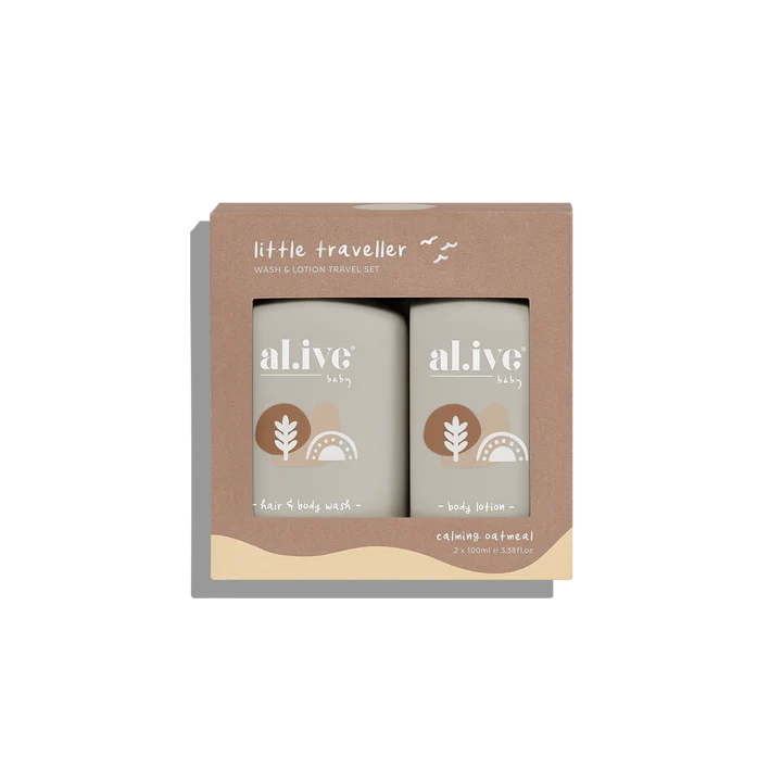 Two bottles of 'alive' body wash and lotion in a cardboard box labeled 'little traveller'.