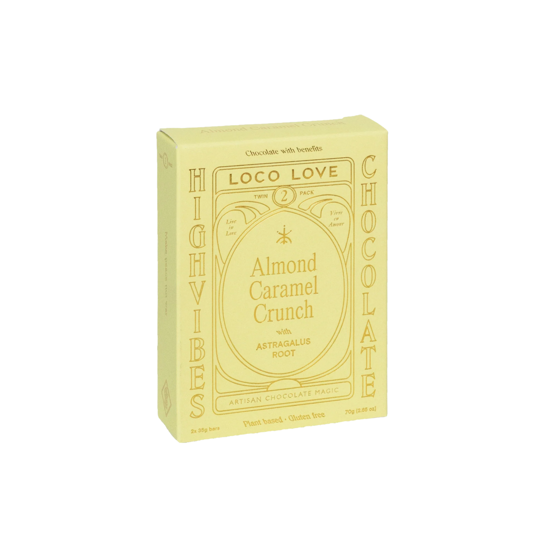 Yellow packaging of Loco Love Almond Caramel Crunch chocolate on a white background