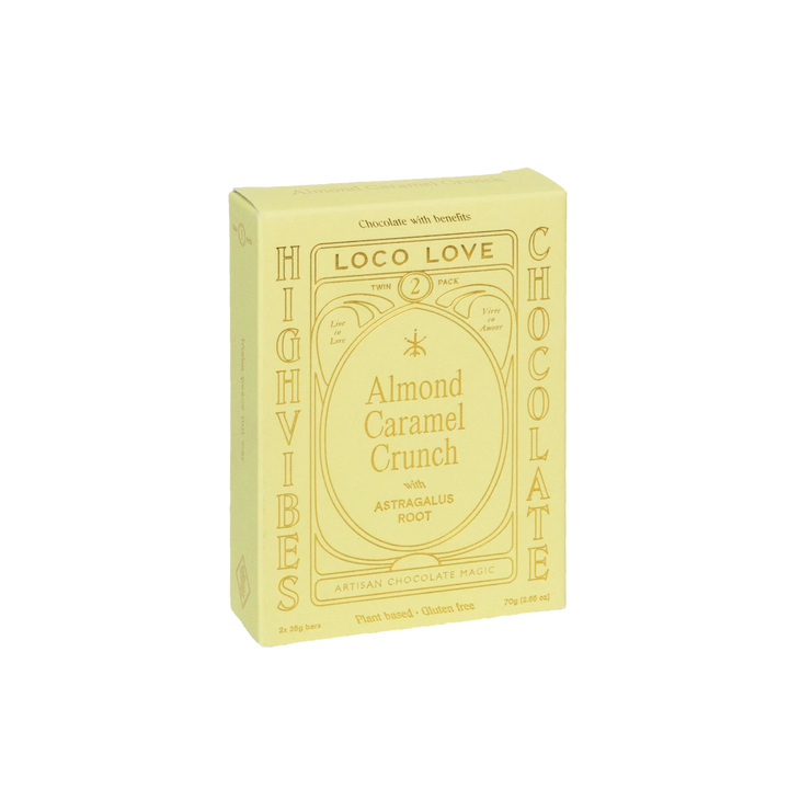 Yellow packaging of Loco Love Almond Caramel Crunch chocolate on a white background