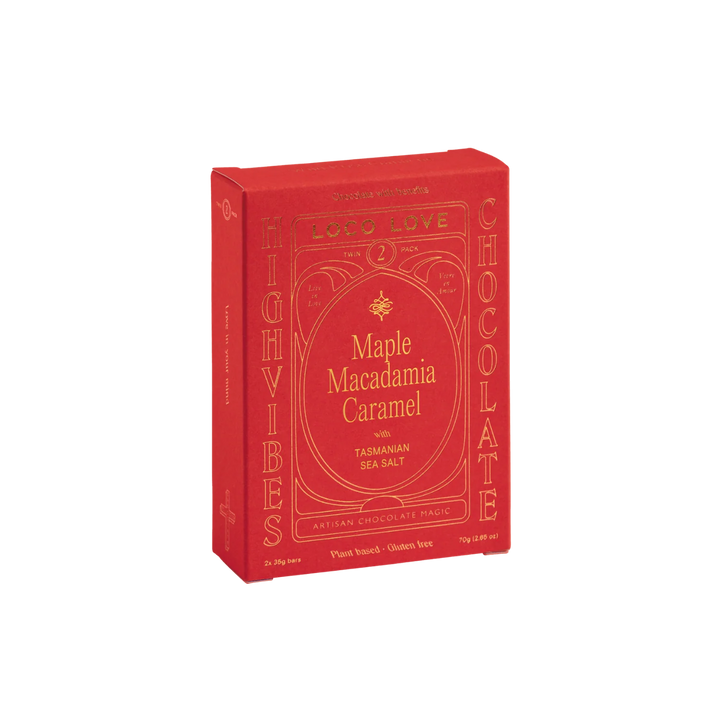 Red box of Maple Macadamia Caramel chocolate on a white background