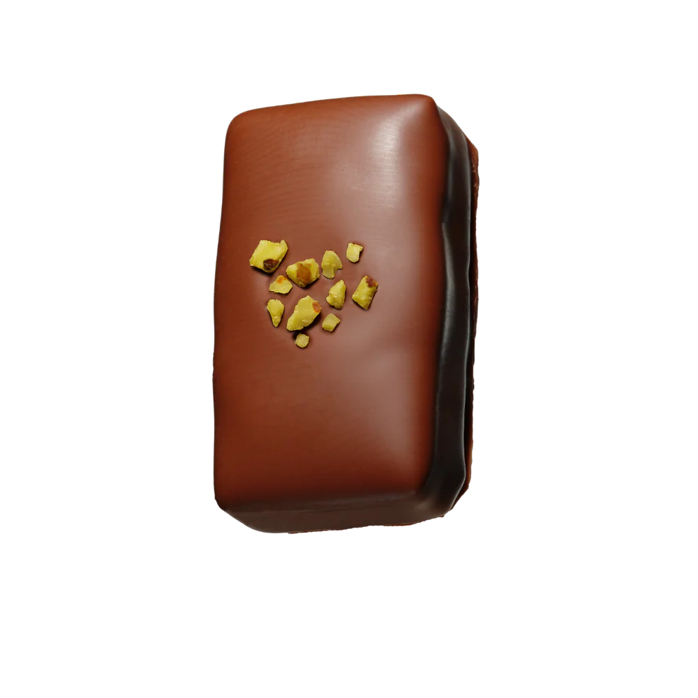 Loco Love chocolate with pistachio toppings on a white background