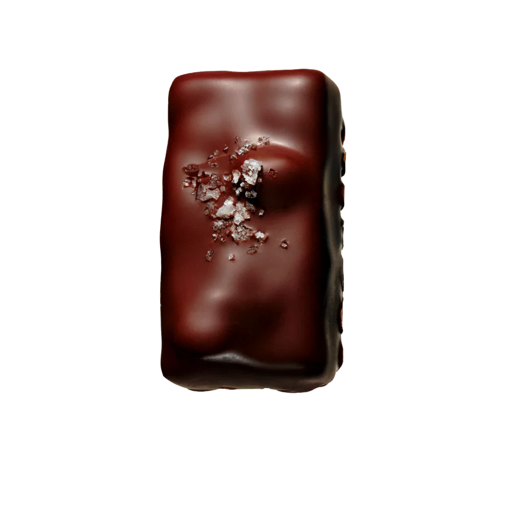 Chocolate bar with sea salt on a white background