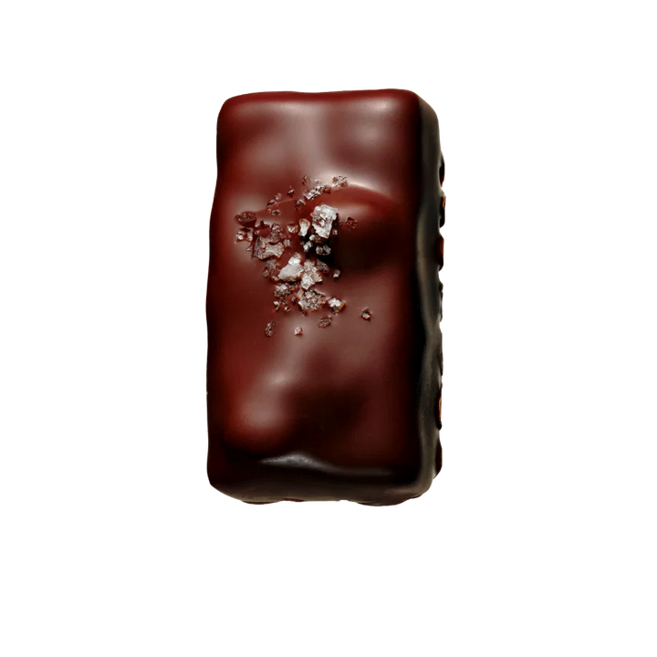 Chocolate bar with sea salt on a white background