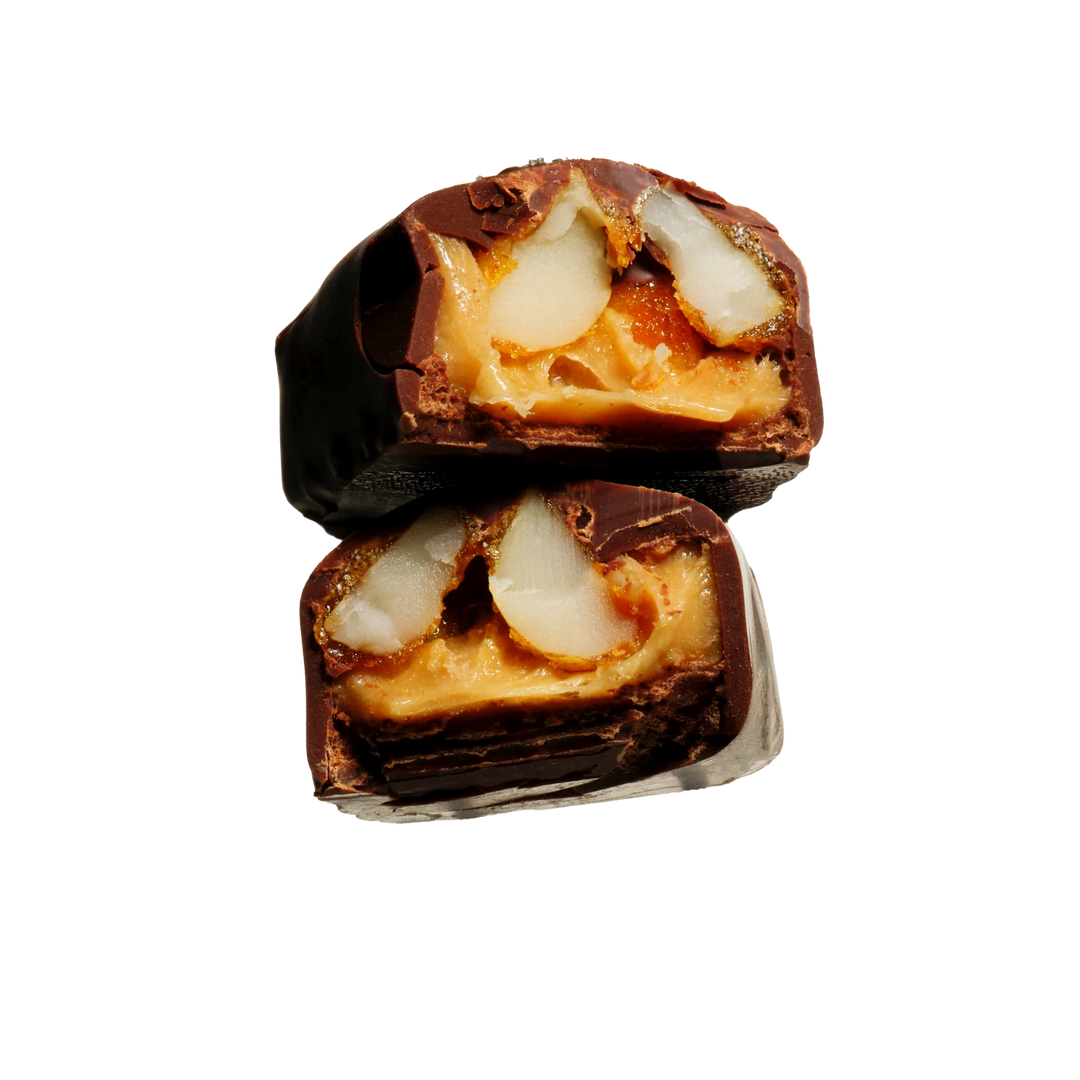 Close-up of a chocolate-covered candy with a white background