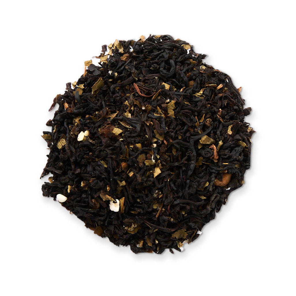 Black tea leaves on a white background