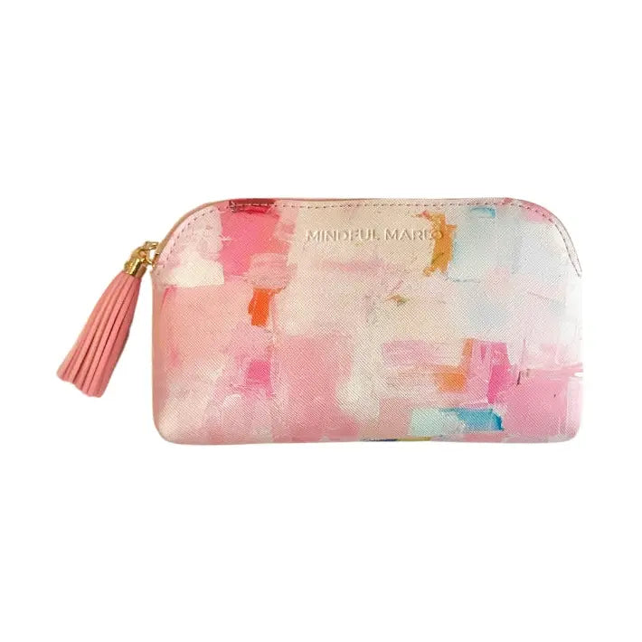 A rectangular zip-around pouch with a pink abstract watercolor design, featuring a pink tassel zipper pull and gold-tone hardware. The brand name &