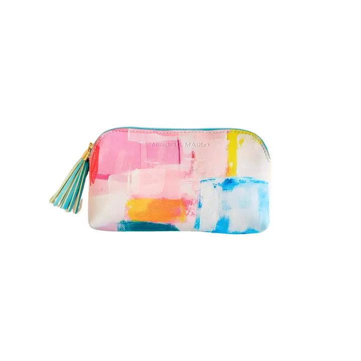 A small zippered pouch with a colorful abstract watercolor print in pink, blue, yellow, orange, and white, featuring a striped tassel zipper pull. The brand name &