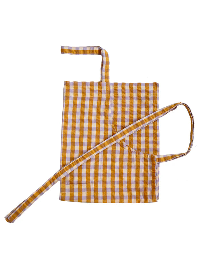 Yellow check seersucker apron on white background