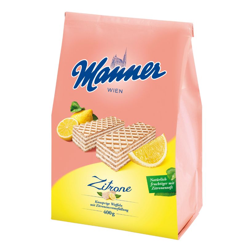A 400g bag of Männer Wien Zitrone lemon-flavored wafers, featuring a pink and yellow packaging design with illustrations of the wafers and fresh lemon slices.