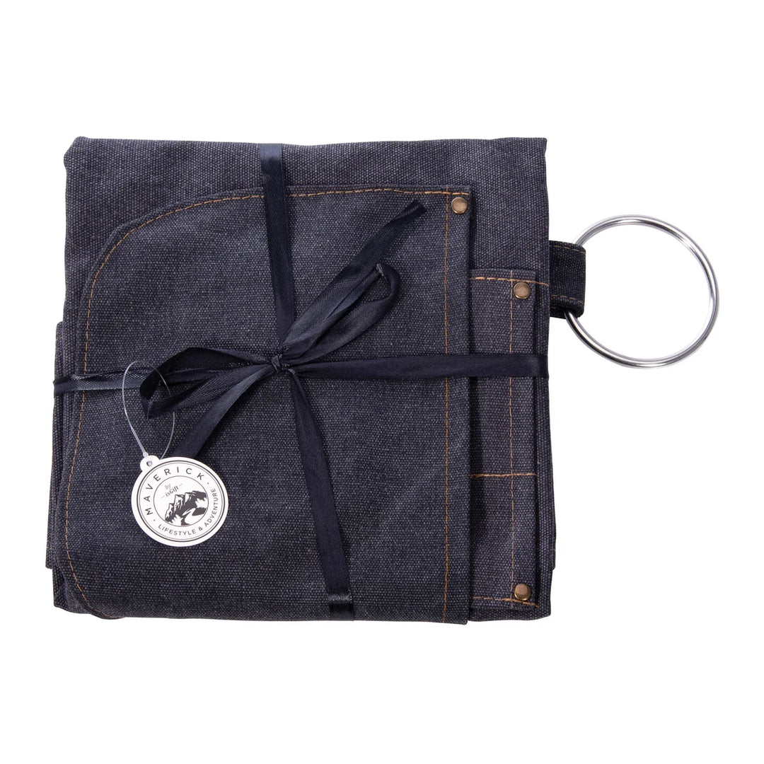 Folded denim fabric with a keychain attached on a white background