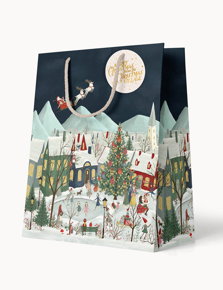 Christmas-themed gift bag with a snowy village design and Santa Claus.