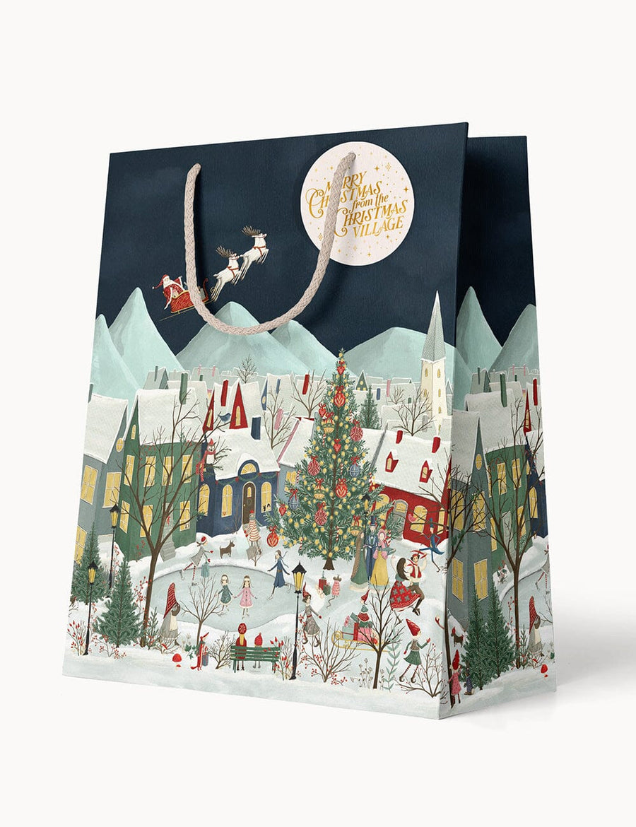 Christmas-themed gift bag with a snowy village design and Santa Claus.