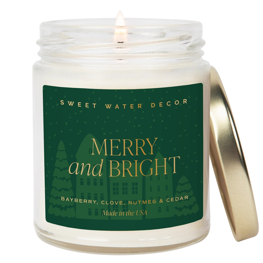 Candle in a jar with a 'Merry and Bright' label on a white background