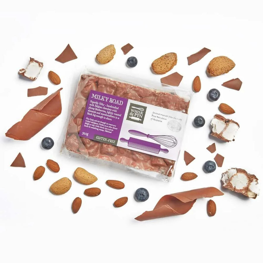 Rocky road surrounded  by ingredients on a white background