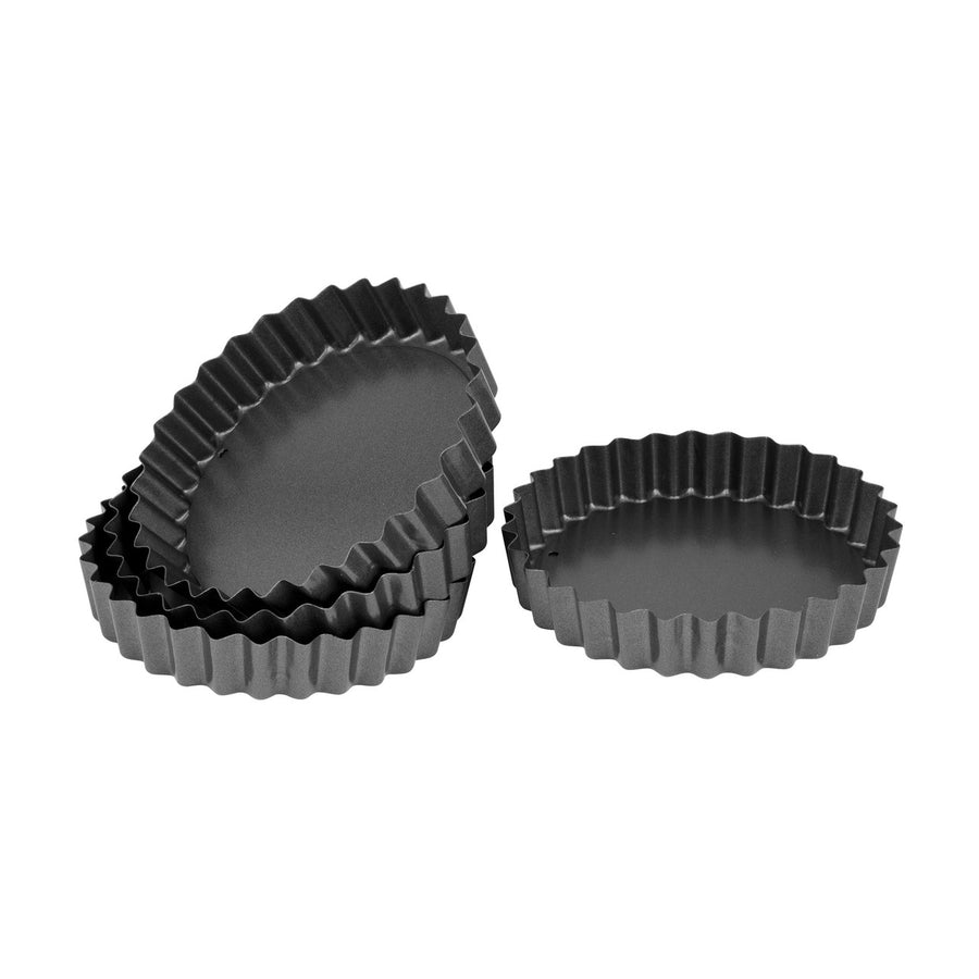 Set of three black fluted tart tins on a white background