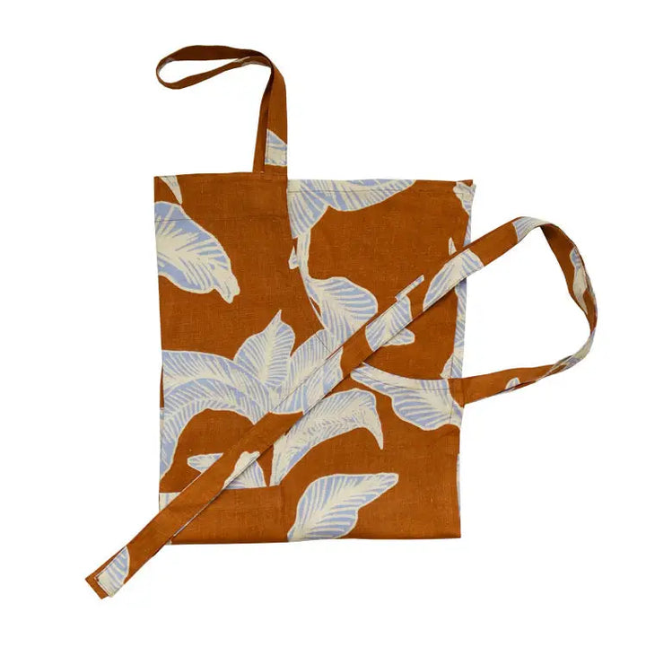 Floral-patterned tote bag with a strap on a white background